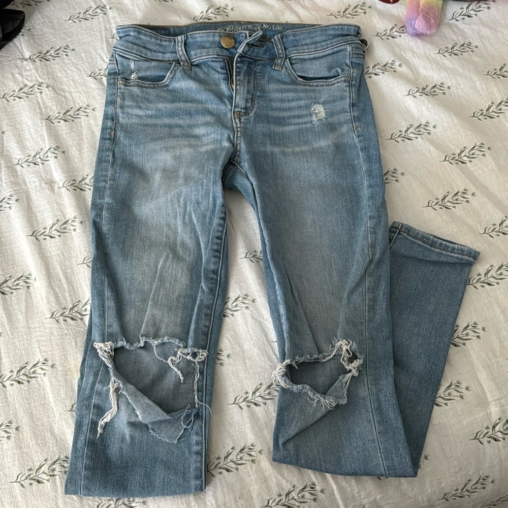 American Eagle distressed at the knee jeans